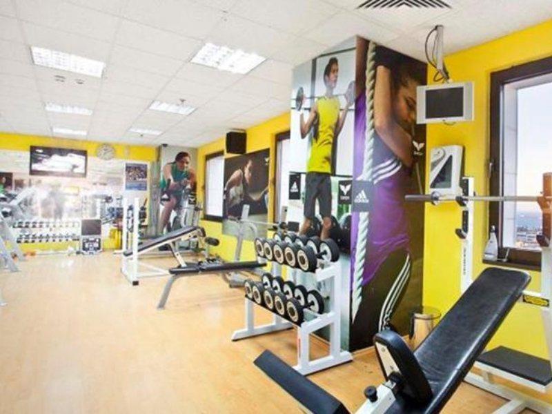 Hilton Izmir Hotel Exterior photo The interior of a typical Anytime Fitness gym